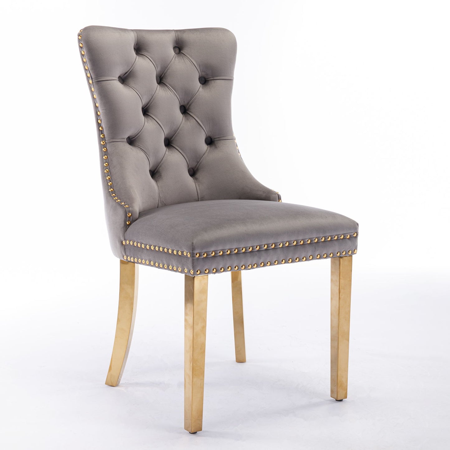 The Nikki dining chair set features modern, high-end gray velvet upholstery, a tufted high back, gold nailhead trim, and golden stainless steel plated legs, shown against a plain white background.