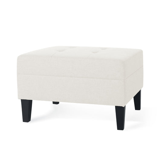 A rectangular Ottoman With Birch Wood Legs And Cushioned Top For Comfort, in light beige with short black legs and a tufted top, is shown on a white background.