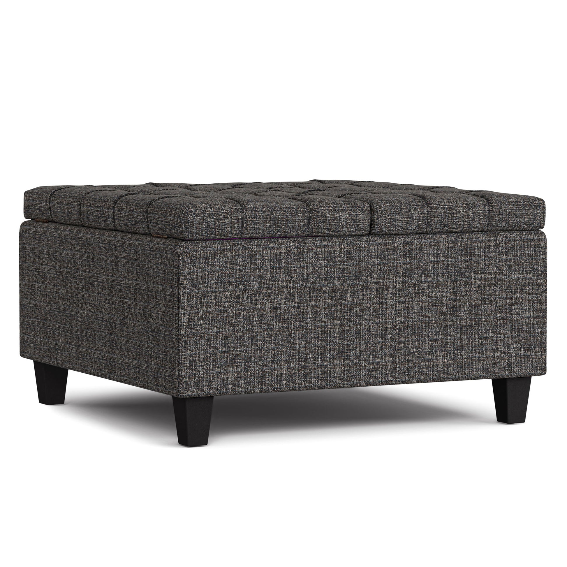 The Harrison Upholstered Coffee Table Storage Ottoman features a square, dark gray tufted design with short black legs, textured fabric, a cushioned top, and offers versatile use as seating, footrest, or storage.