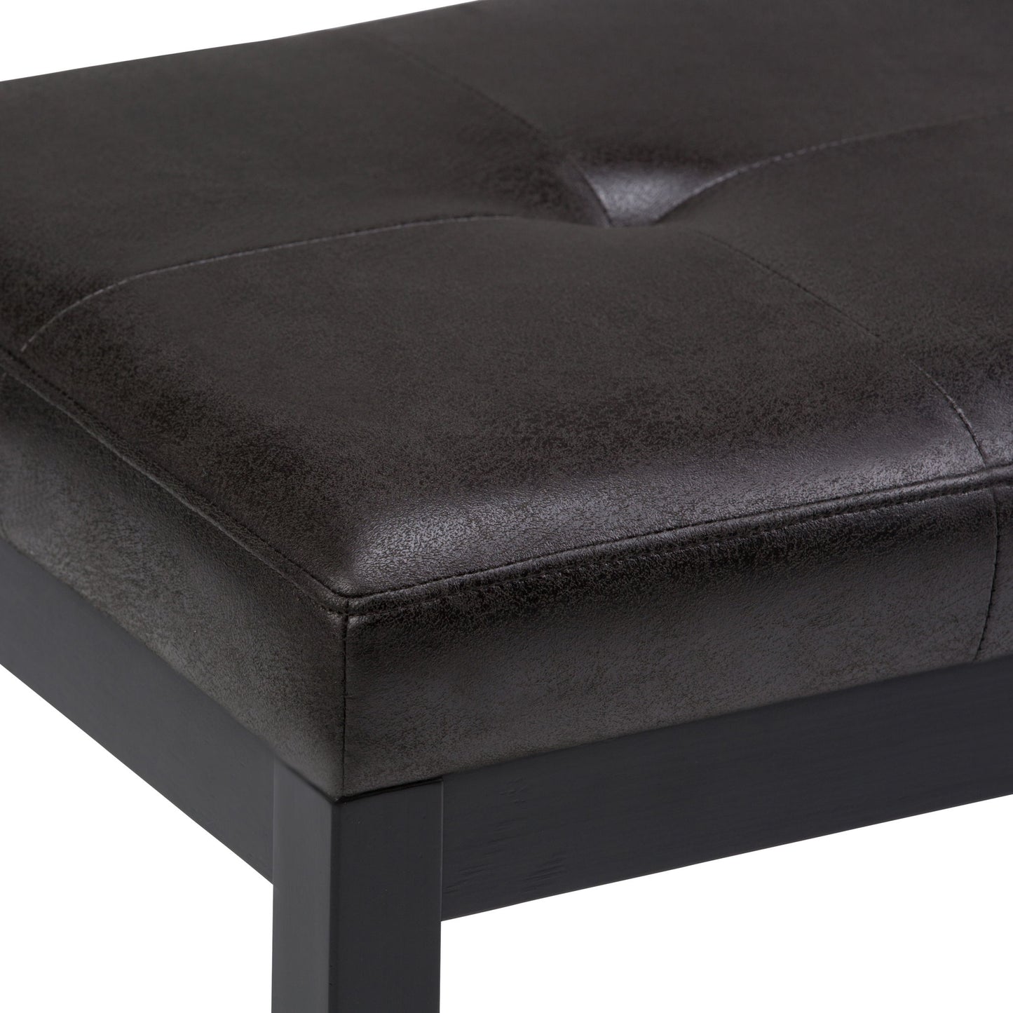 A close-up view of the Lacey - Upholstered Tufted Ottoman Bench, featuring black faux leather with visible stitching and a dark wooden frame.