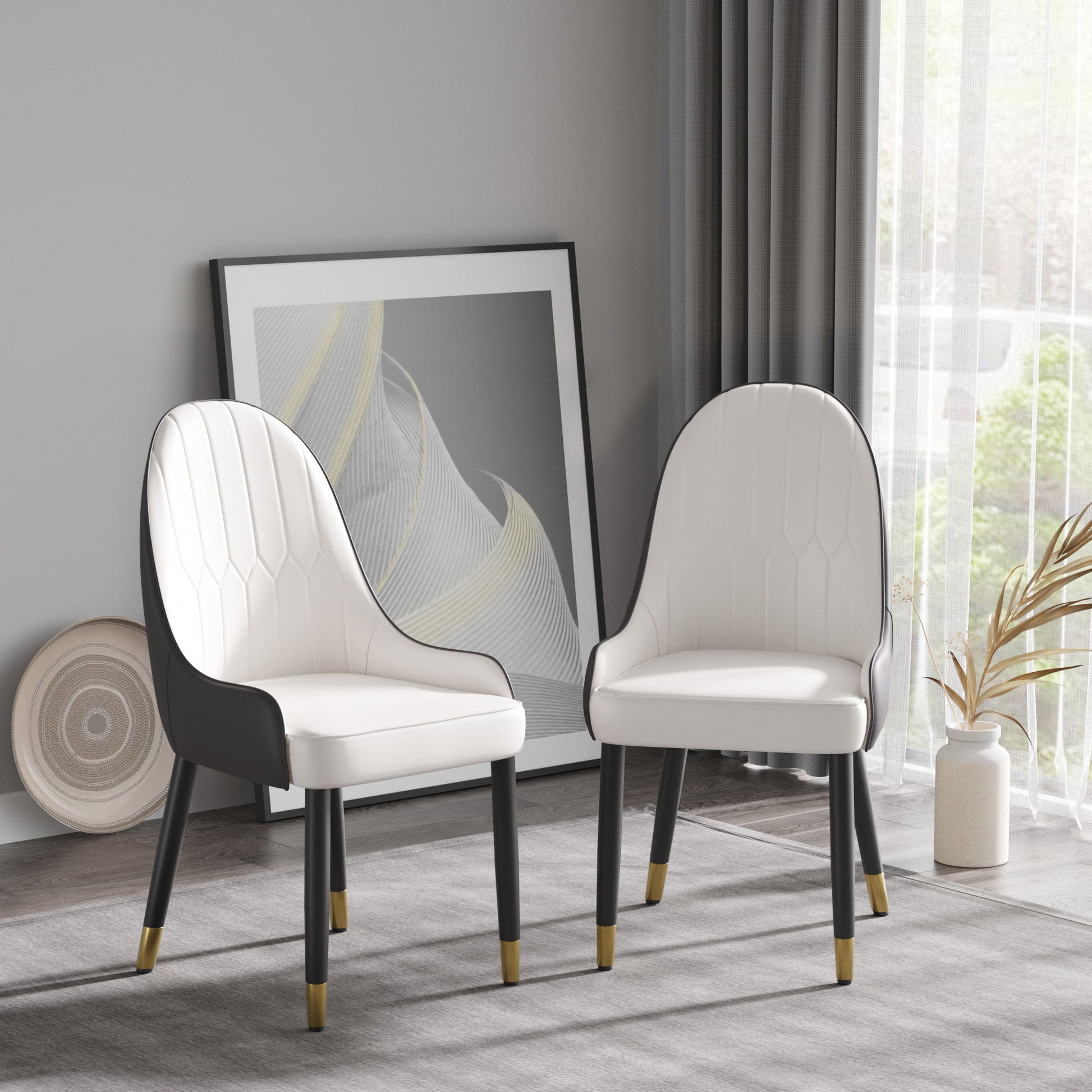 A set of 2 Modern PU Sponge-Filled Dining Chairs with solid wood metal legs sits in a minimalist room beside a large abstract artwork, neutral rug, and dried plants by a window with sheer curtains. Suitable for restaurants or living spaces.
