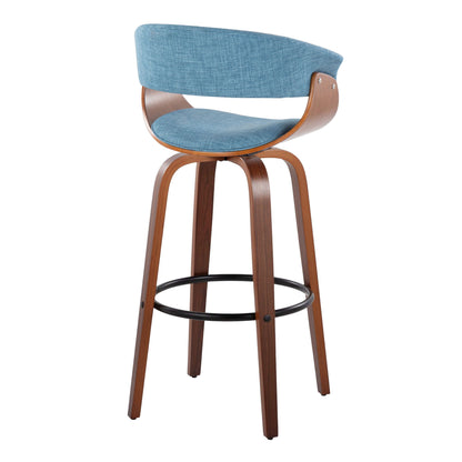 The Vintage Mod Mid Century Modern Fixed Height Barstool (Set of 2) features curved wooden legs, a blue upholstered seat and backrest with wood frame, swivel functionality, and a round black metal footrest.