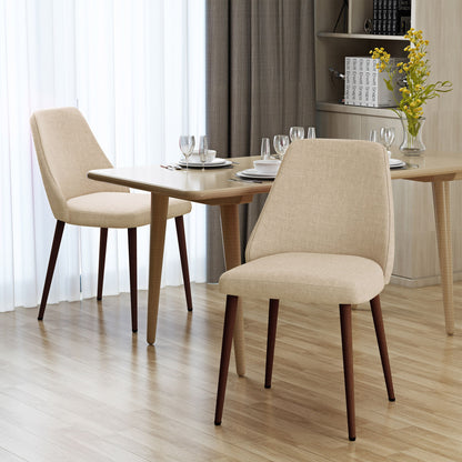 Two Modern Dining Chairs with iron legs and wood finish are arranged around a light wooden dining table set with plates, glasses, and cutlery. A vase of yellow flowers sits on the table in a bright, modern dining room.