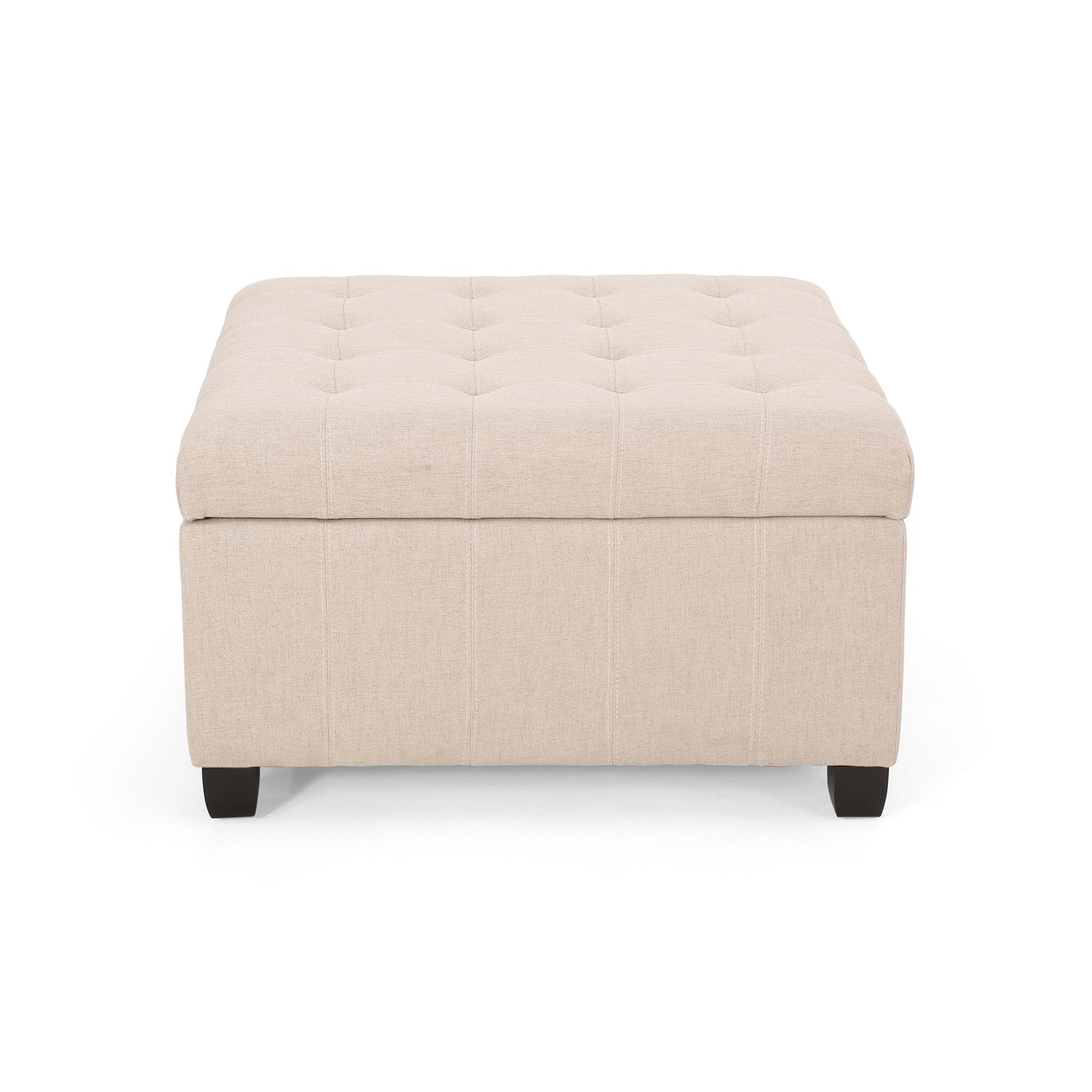 The Isabella Contemporary Ottoman With Storage is beige, square, and tufted, featuring short dark wooden legs and shown from the front against a white background.