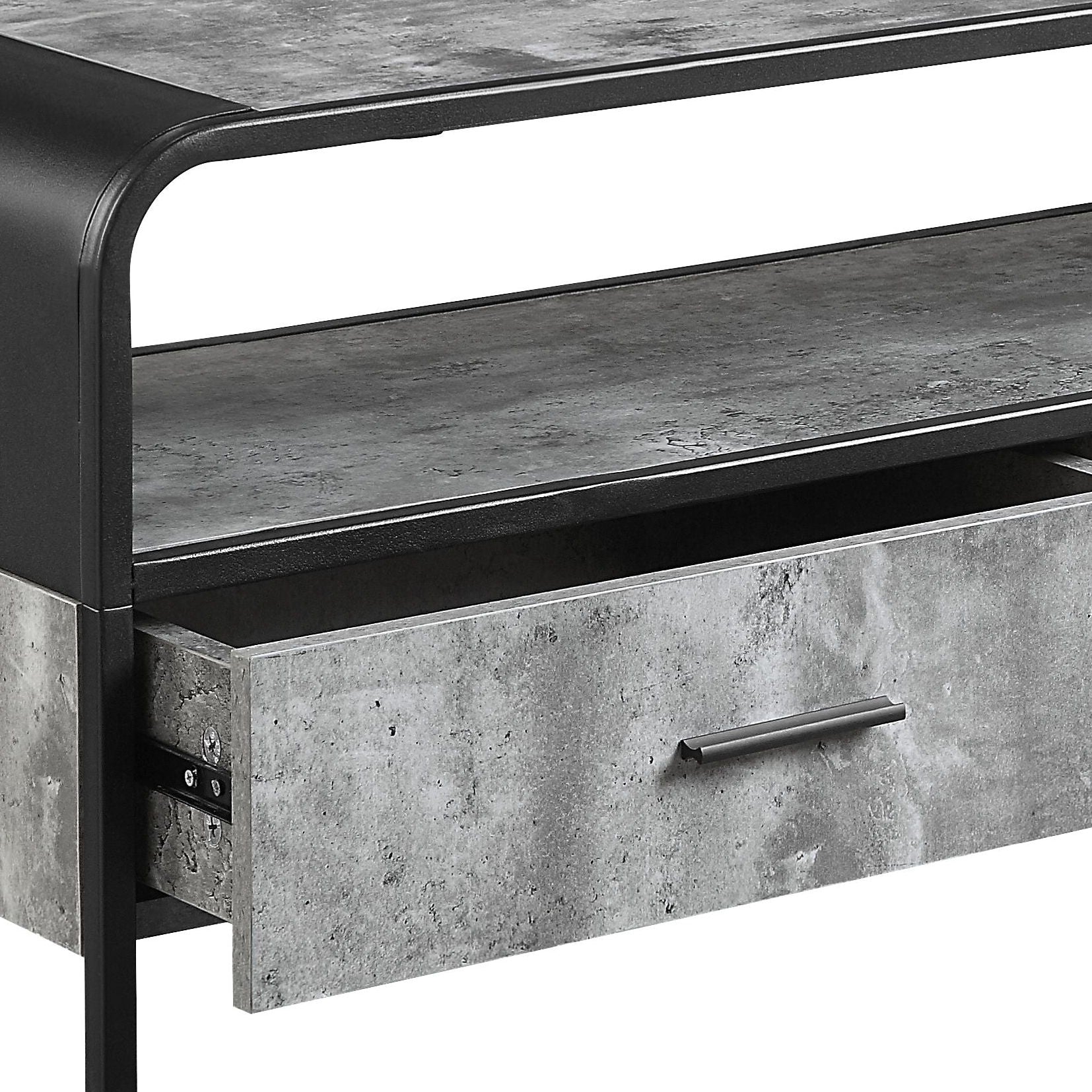 A close-up of the Raziela TV Stand & Storage showcasing its concrete-like finish, metal frame, shelf, and an open drawer with a sleek handle.