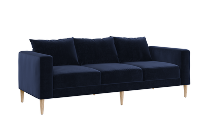 The Essential Sofa features a sleek, modern design with navy blue velvet upholstery, three cushions, and wooden legs, all set against a white background.