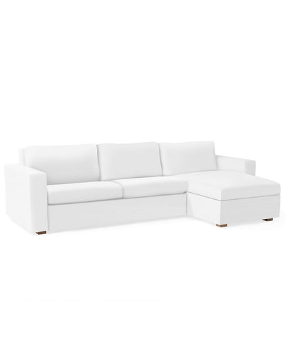 A Conover Sleeper Chaise Sectional in white, featuring an L-shaped design with cushioned seats and a right-side chaise, set against a plain white background.