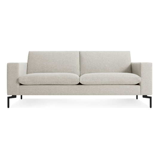 The New Standard 78" Sofa in Maharam Mode Clavicle features square armrests, deep seat cushions, two back cushions, and slim black legs for a modern look.
