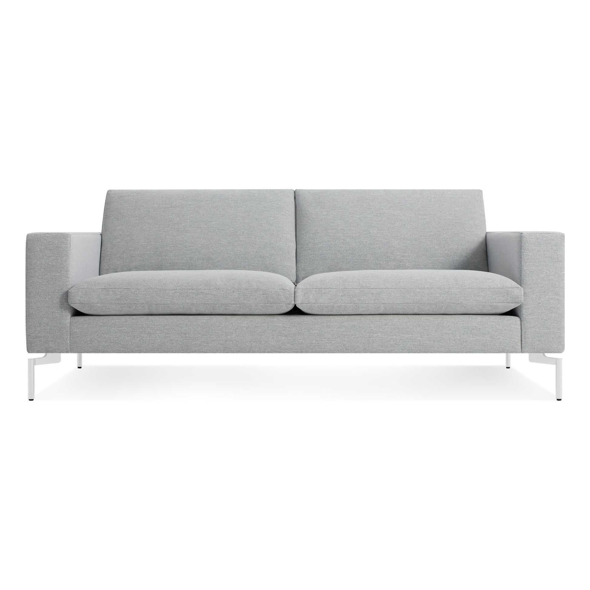 The New Standard 78" Sofa in Maharam Mode Intaglio/White features a modern light gray design with straight armrests, plush seat and back cushions, and white metal legs, displayed against a plain white background.
