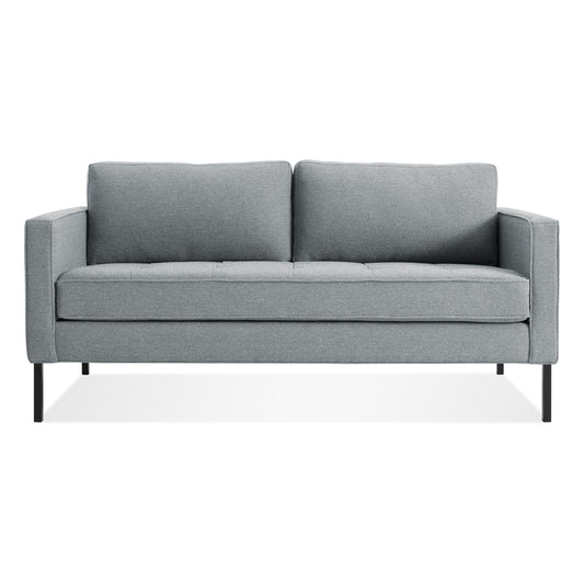 The Paramount Studio Sofa in Sanford Ceramic features a gray modern three-seater design with straight arms and black metal legs, displayed against a plain white background.