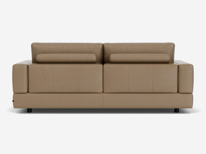Back view of the Stage Track Sofa, a modern piece crafted in brown leather featuring adjustable headrests and short black legs. This sofa boasts a sleek, minimalist design, making it ideal for contemporary interiors.