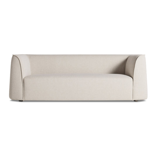 The Thataway 88" Sofa, Maharam Mantle in Future, features a modern minimalist design with a low back, wide armrests, and smooth beige upholstery, displayed front-facing against a white background.